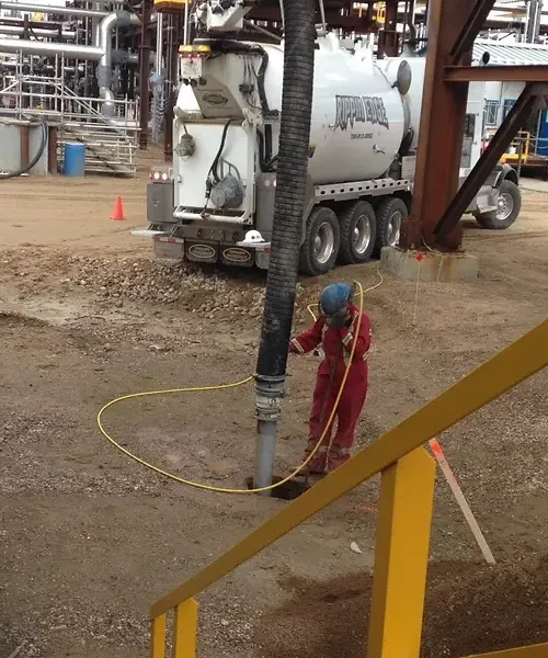 Hydrovac working excavating with wand-like tool