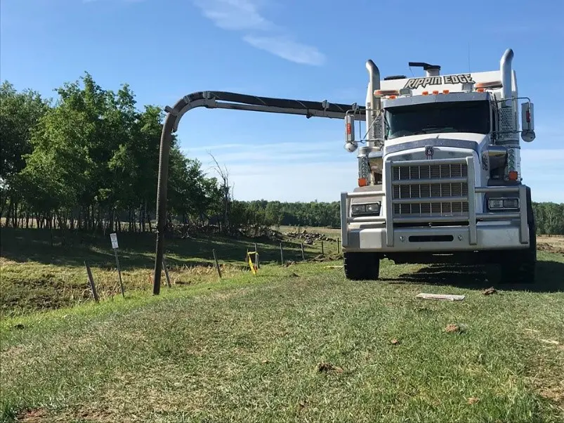 Rippin Edge hydrovac truck working in property line ditch